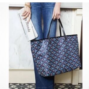 Stella & Dot Reversible Voyage Tote in Black and Tribal includes pouch.